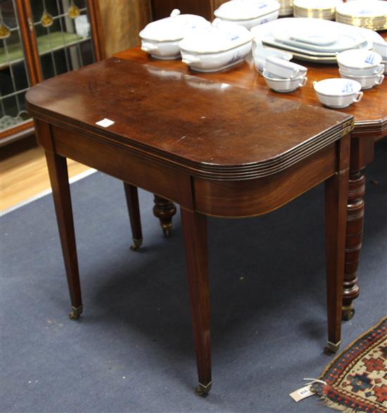 A George III mahogany folding top tea or card table, W.91cm